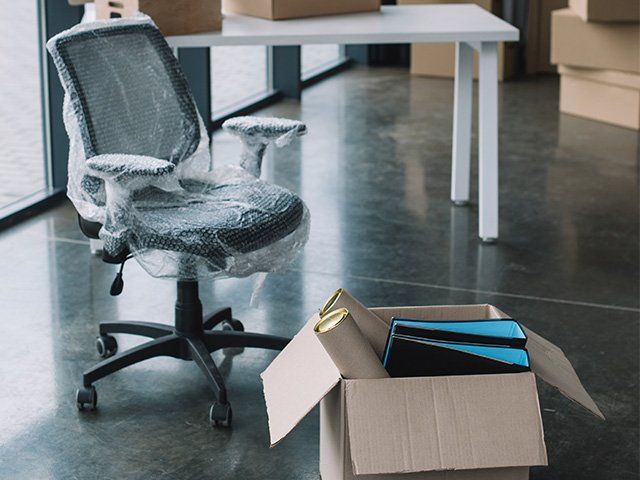 Office Chair in Bubble Wrap and Box with Office Supplies - Removal Service in Westcourt, QLD