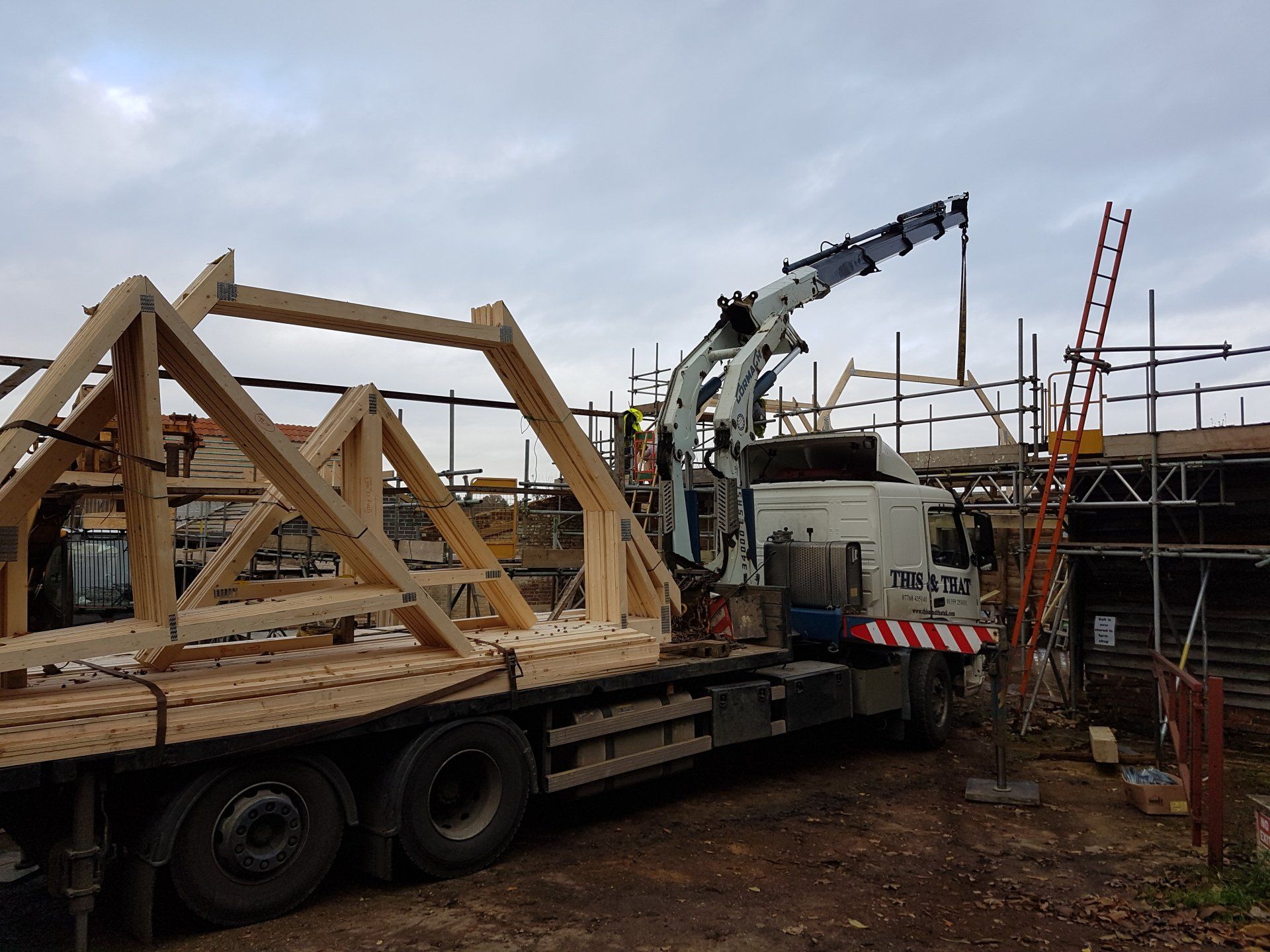 crane carrying temporary wooden frames