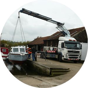 lorry crane moving boats to the sea side