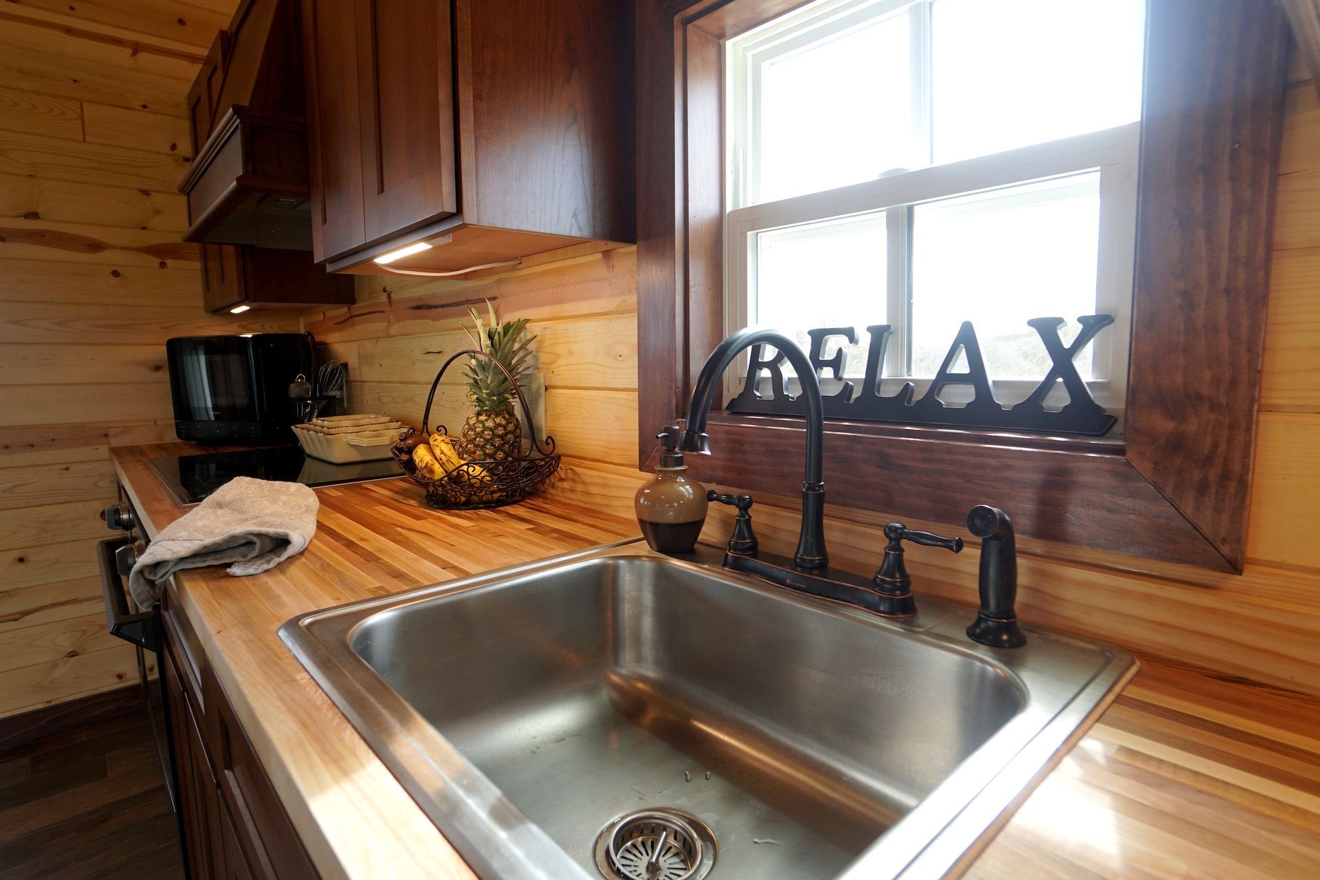 Kitchen with wood countertops, stainless steel sink, and 
