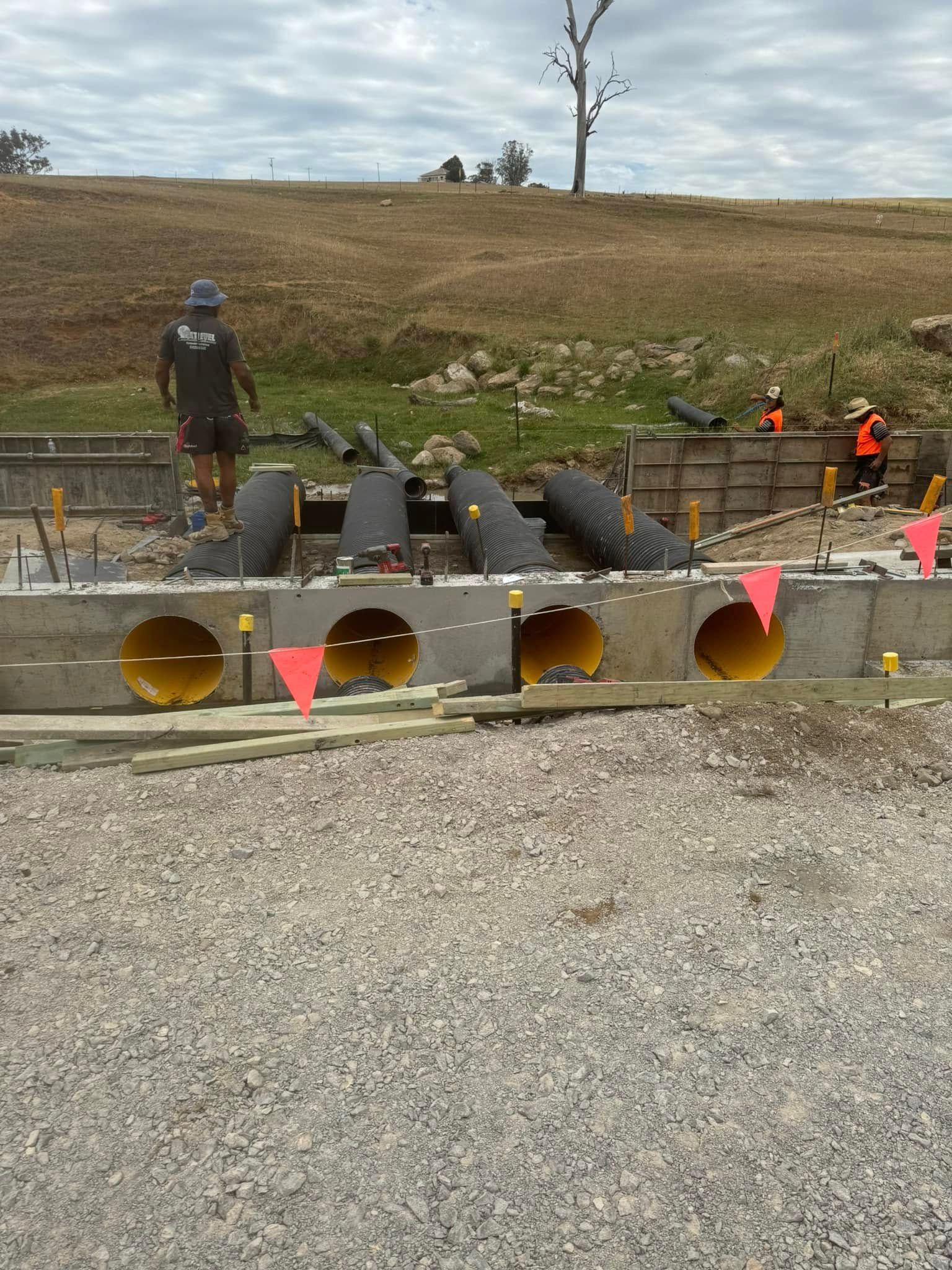 A Group of Construction Workers Are Working on A Construction Site — Next Level Construction Contractors in Gundagai, NSW