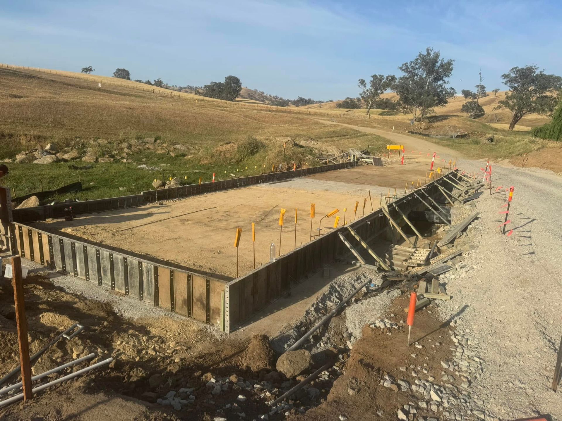 A Group of Construction Workers Are Working on A Concrete Floor — Next Level Construction Contractors in Wagga Wagga, NSW