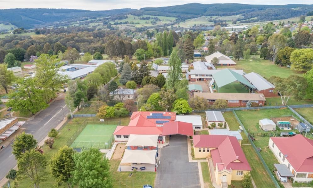 An Aerial View of A Small Town with Lots of Buildings and Trees — Next Level Construction Contractors in Batlow, NSW
