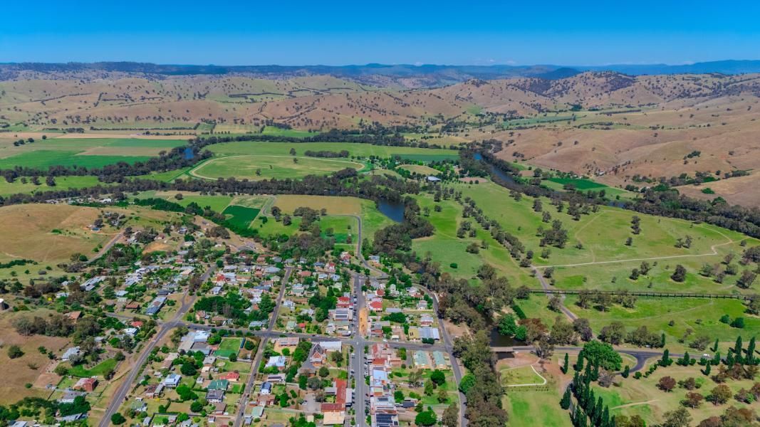 An Aerial View of A Small Town Surrounded by Fields and Mountains — Next Level Construction Contractors in Gundagai, NSW