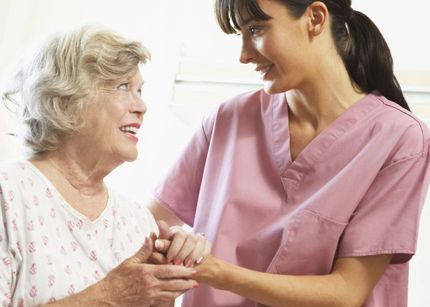 A nurse providing aged care with a resident in Auckland