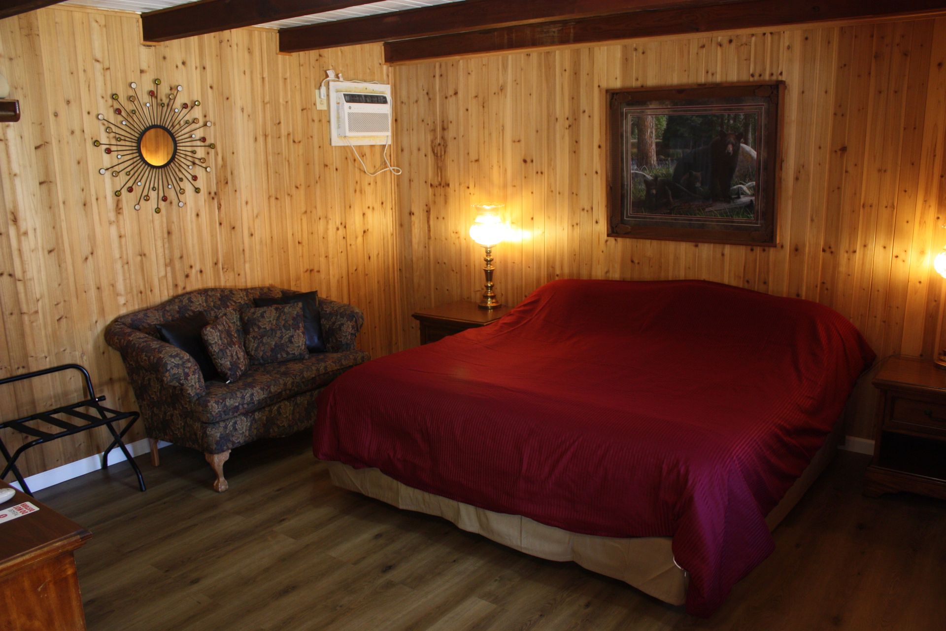 A bedroom with a bed and a couch in it