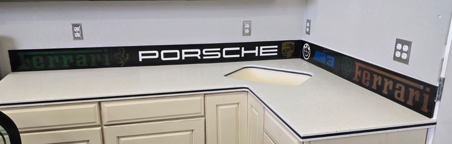 A kitchen with a sign that says porsche on it