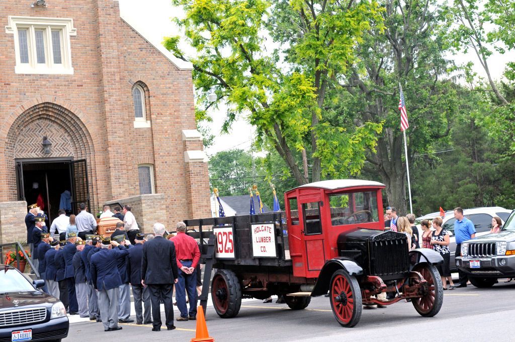 a red truck with the number 1975 on the back