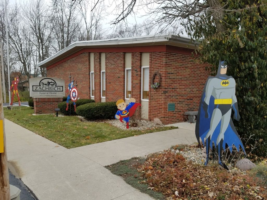 a brick building with a sign that says zachrich