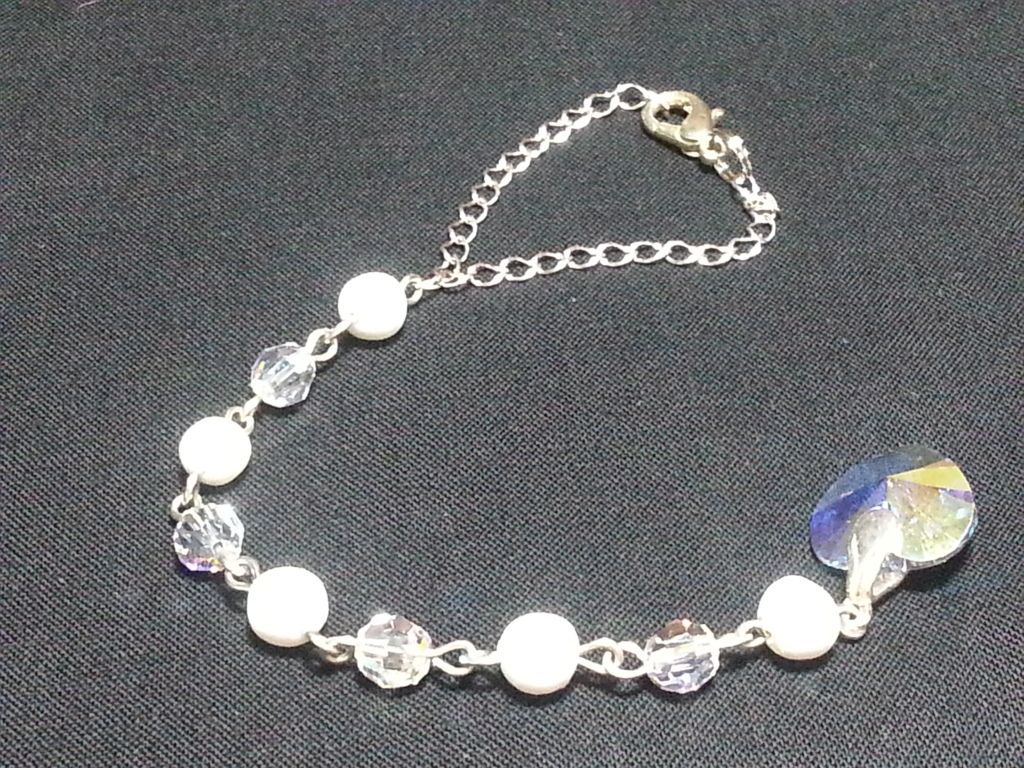 a bracelet with pearls and crystals on a chain