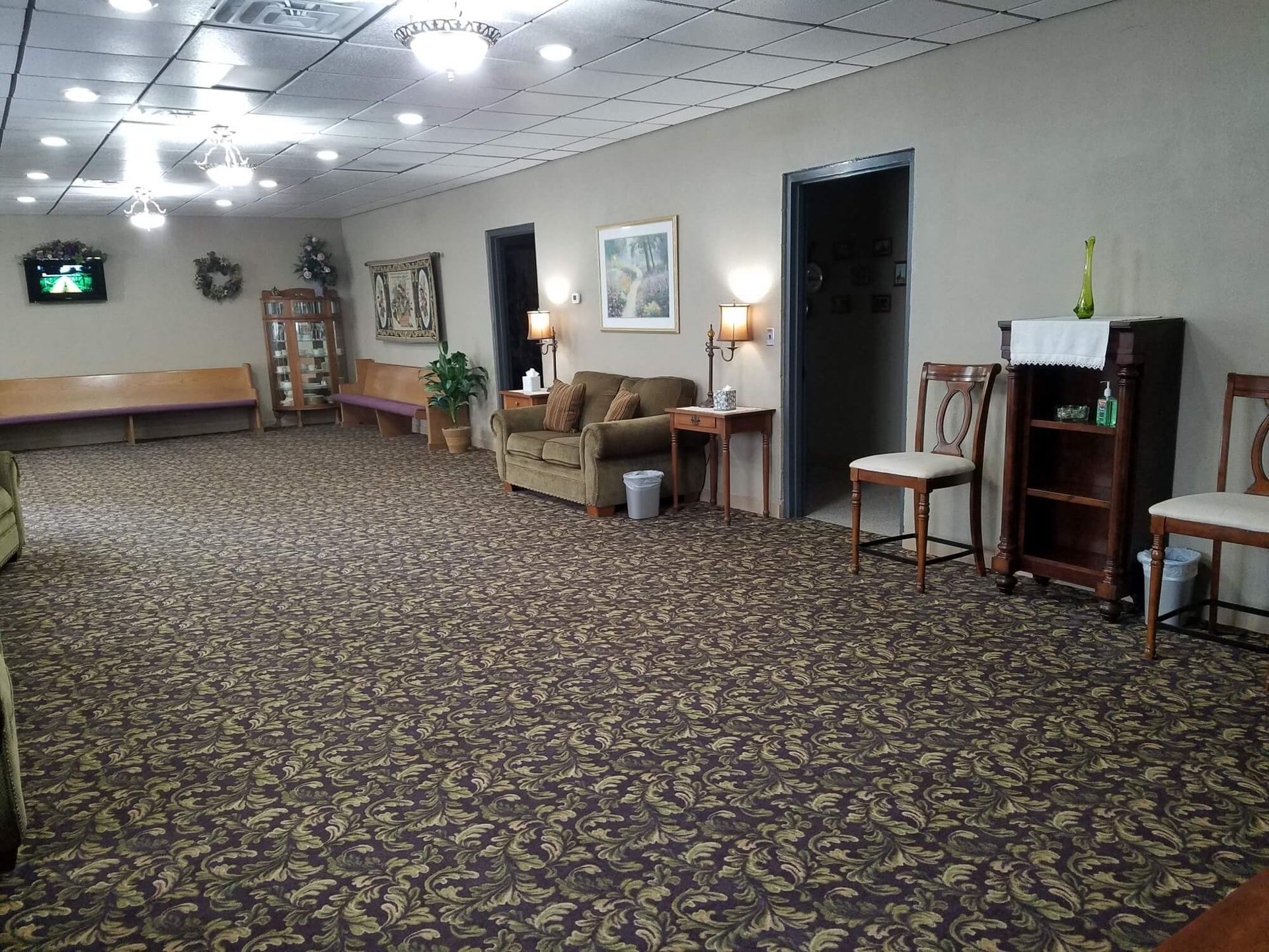 a living room with a couch and chairs in it