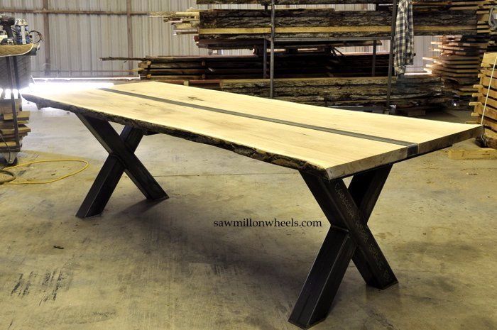 Industrial steel table with live edge slab wood top. Made at sawmill on wheels live edge shop.