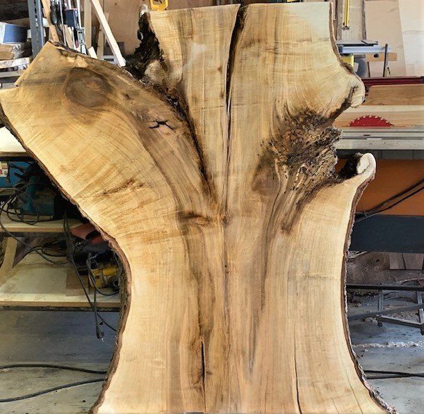 Wide Maple live edge wood slab.