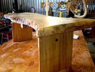 rustic bench crafted from a large wood slab