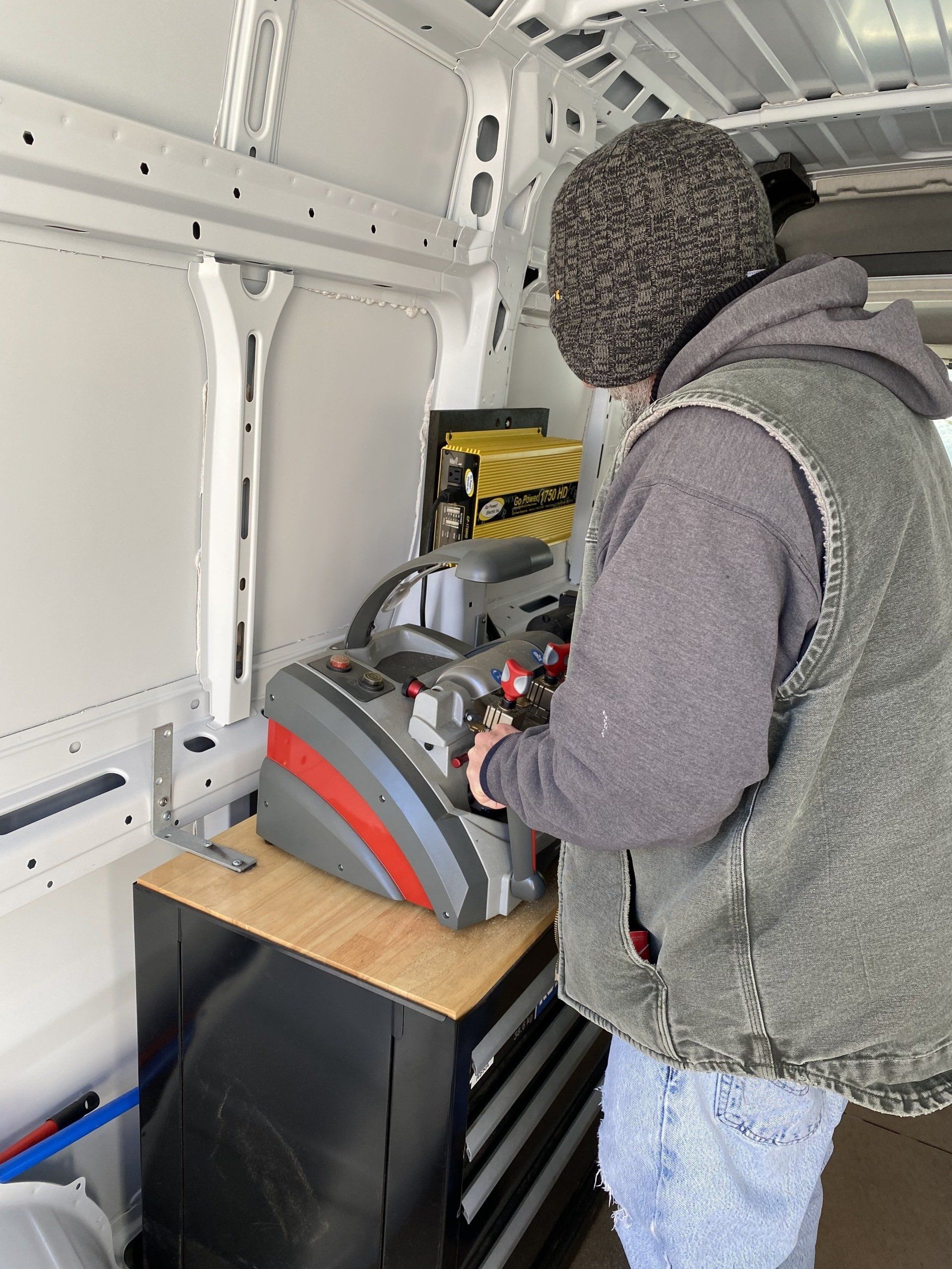 Man Using Key Machine — Lanconia, NH — Bob’s Lock & Key LLC