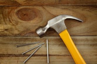 Hammer and nails on floor
