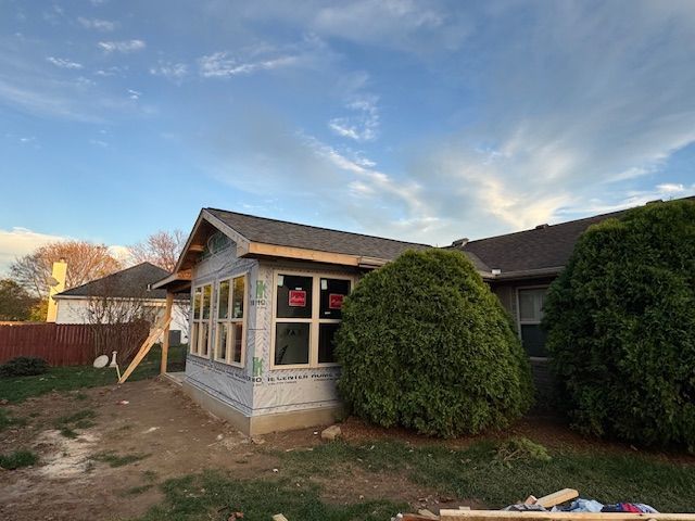 A house is being built with a lot of windows.