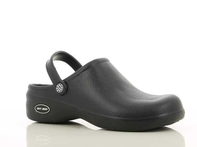 A pair of black clogs on a white surface