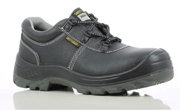 A pair of black safety shoes are sitting on a white surface.