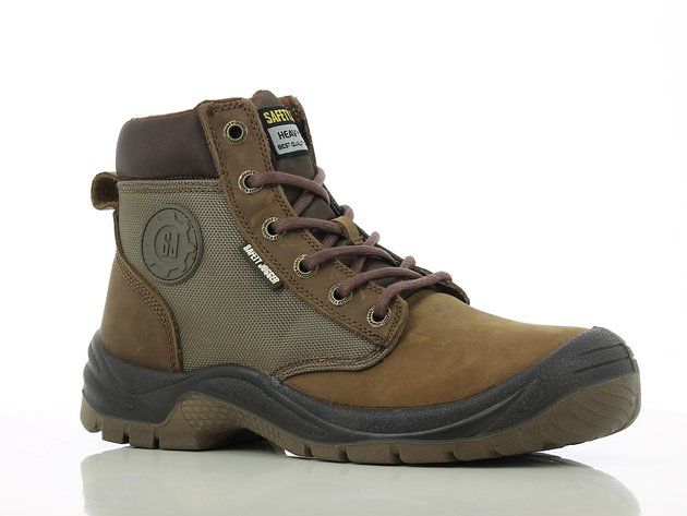 A pair of brown and black safety boots on a white surface.