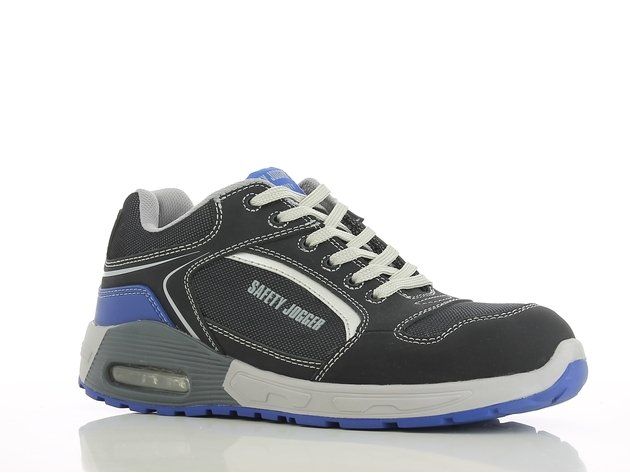 A pair of black and blue safety shoes on a white surface.