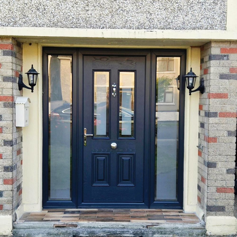 The front door of a brick house with a black door