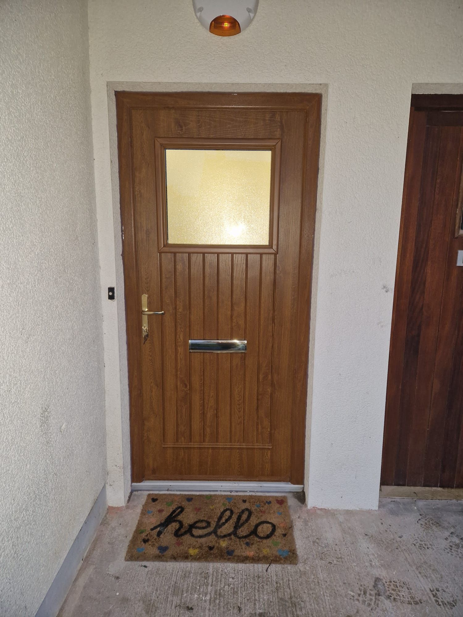 A door with a hello mat in front of it