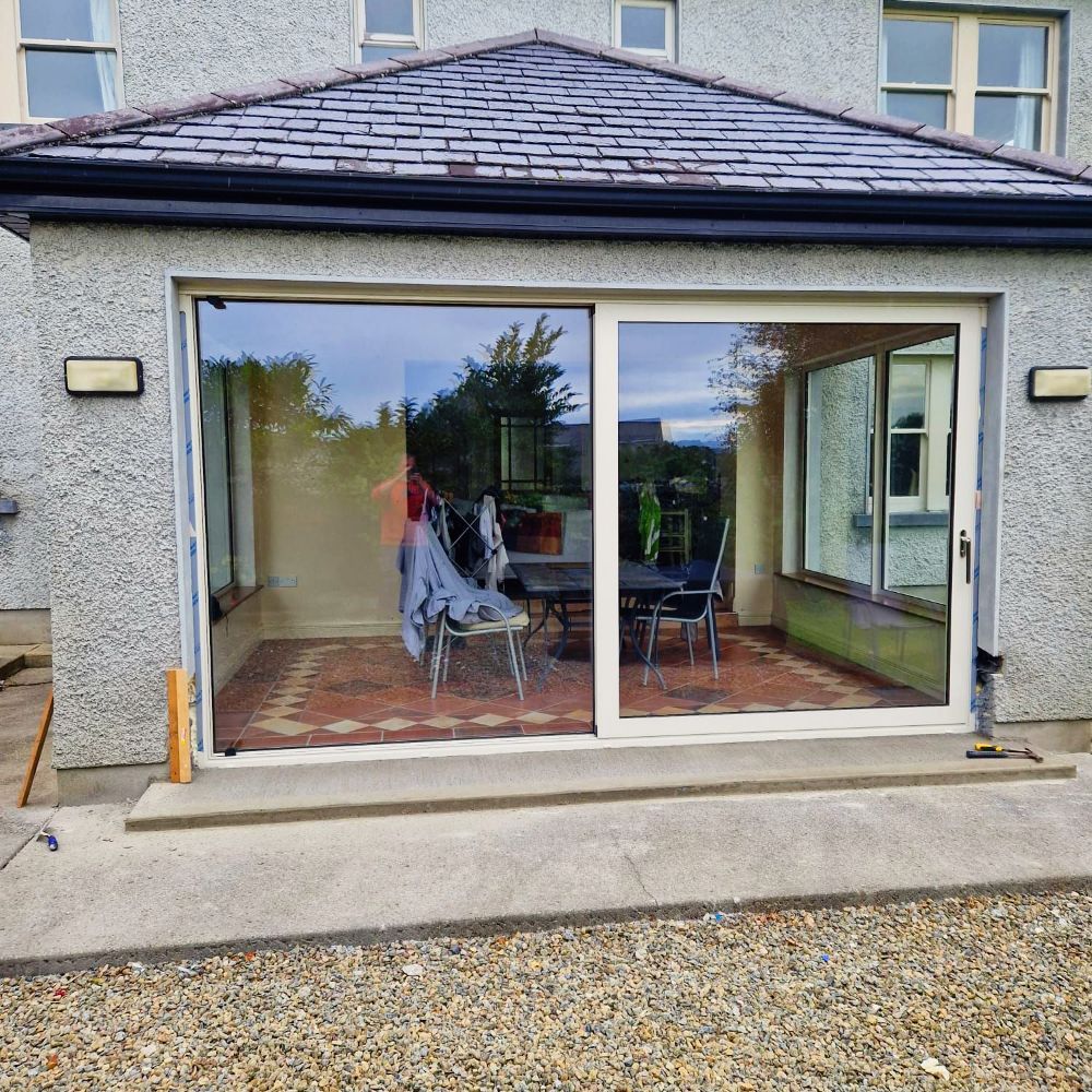 A house with a sliding glass door leading to a patio