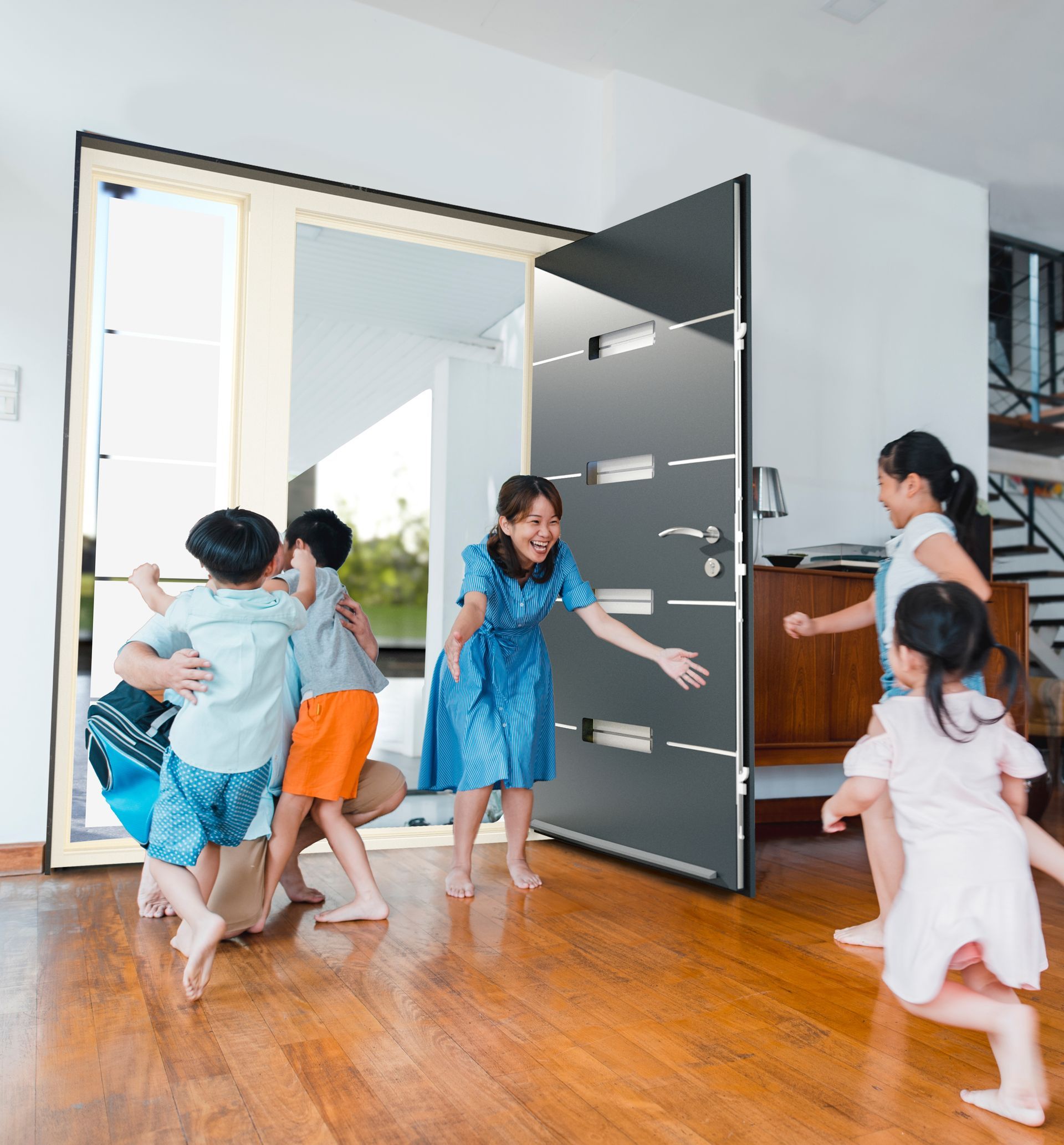 A group of children are running towards a woman in a doorway.