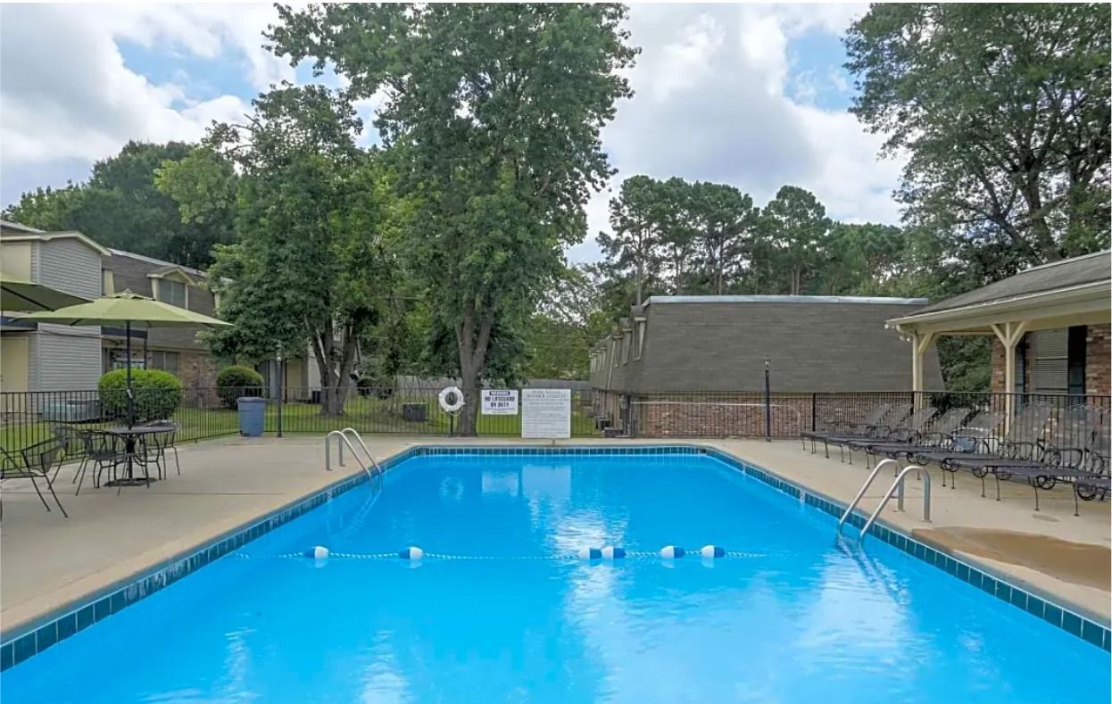 Camelot apartment swimming pool and trees