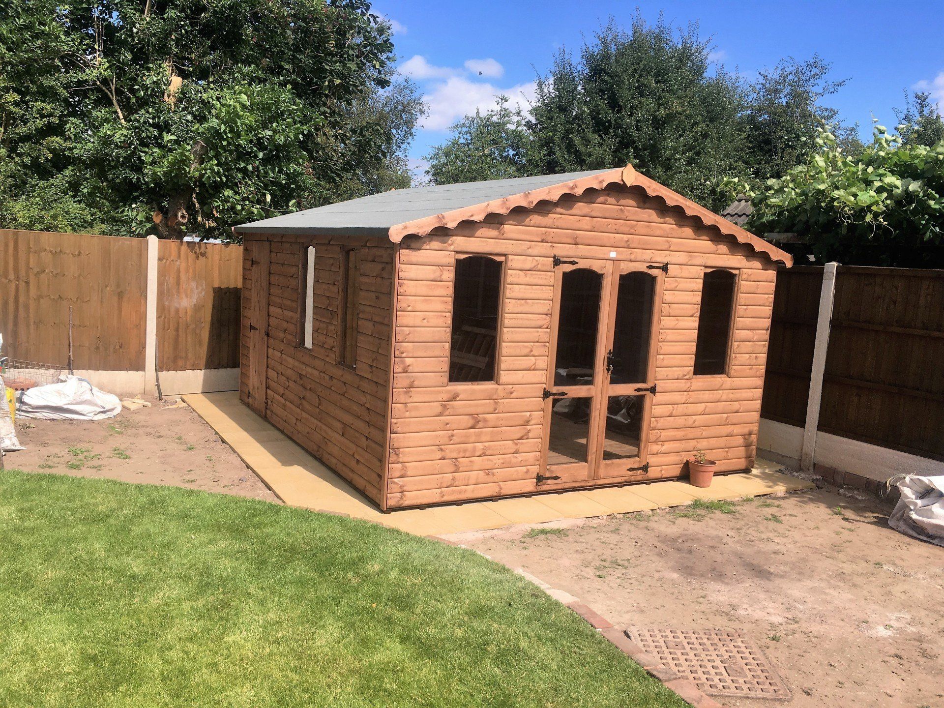 Pent shed side of property