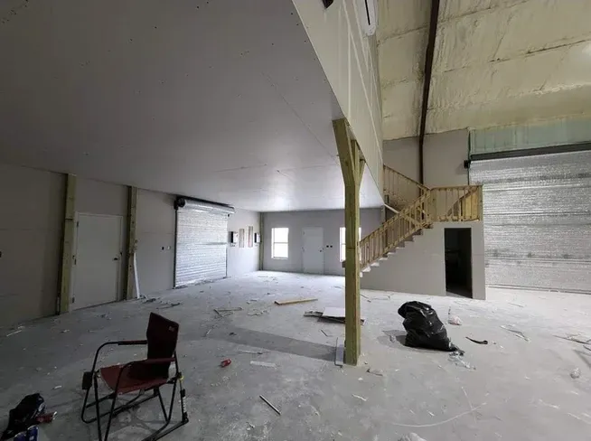 There is a rocking chair in the middle of the room.