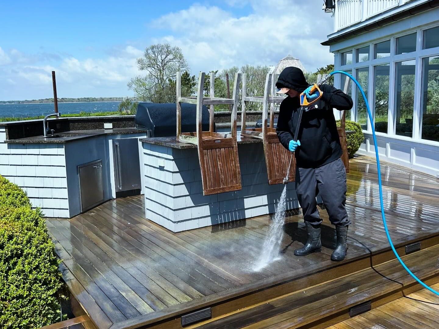 Deck pressure washing at a home on Long Island by KOS Cleaning