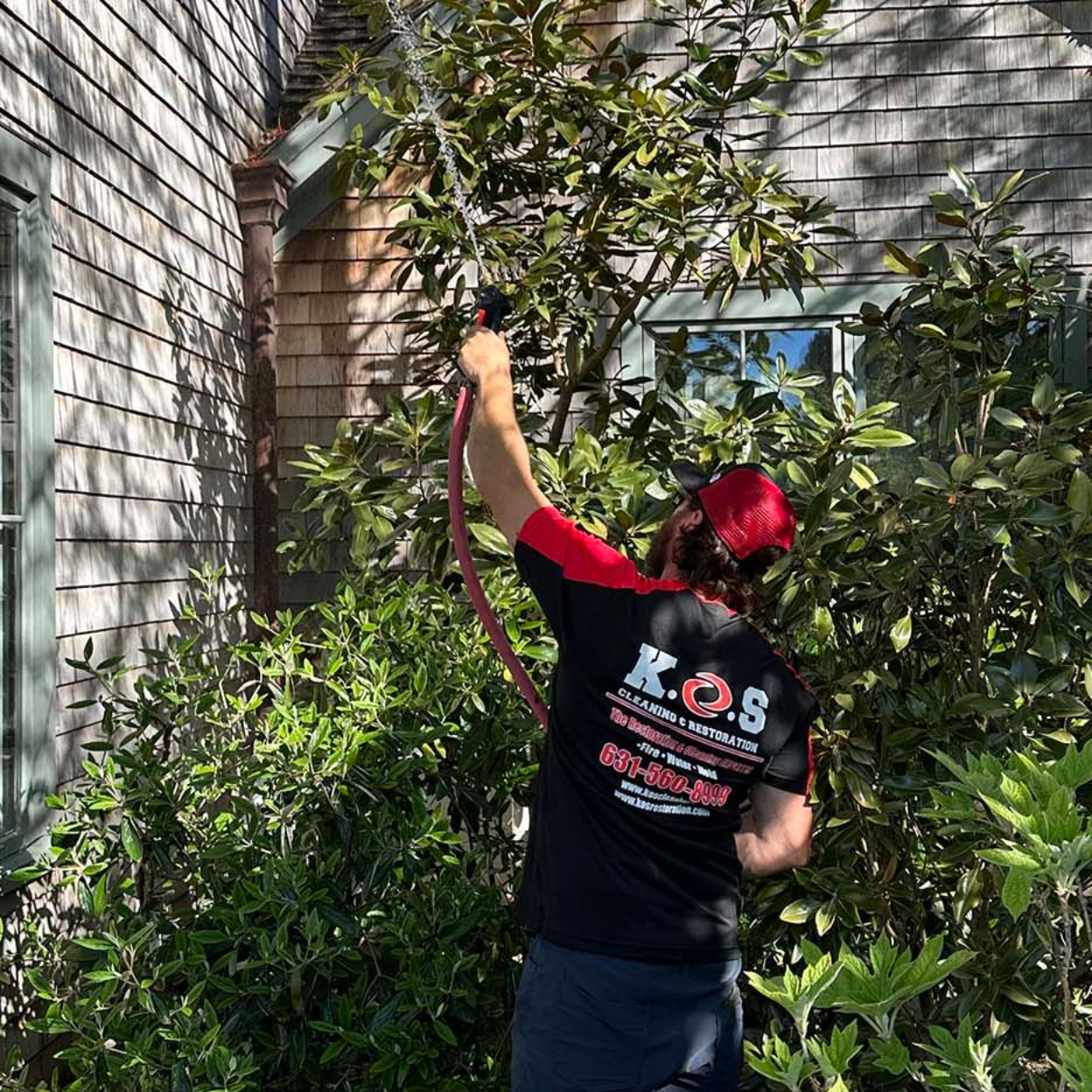 soft washing cedar shake siding on a home in Suffolk County NY