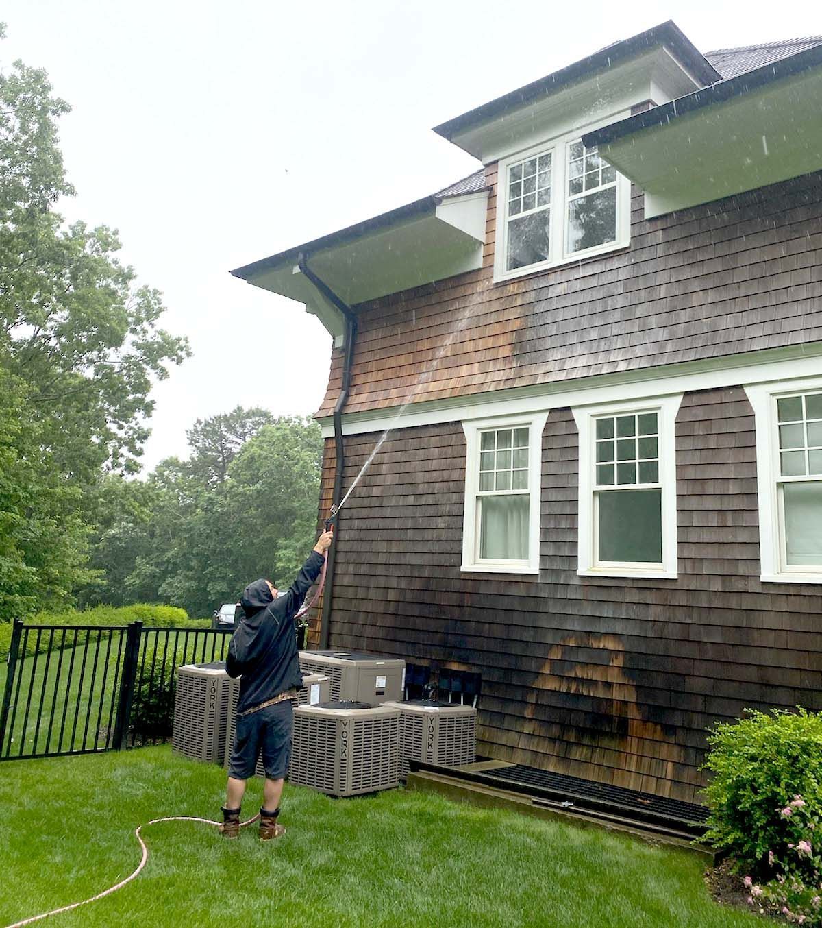 Soft washing of cedar shake siding at a Long Island Hamptons home. KOS offers expert soft washing services on Long Island. 