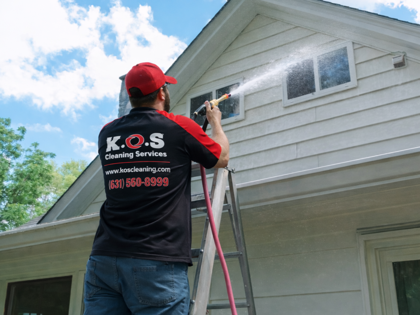 Soft washing vinyl siding at a home in Suffolk County. 