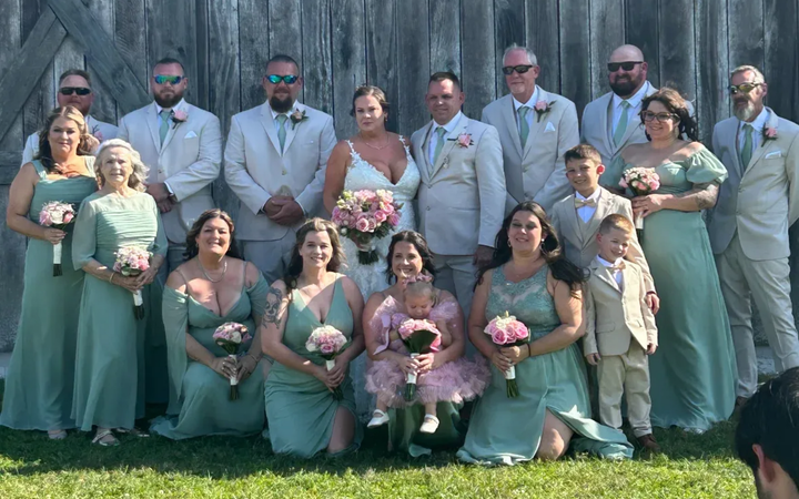 wedding party in orlando posing with bella bridal outlet dress
