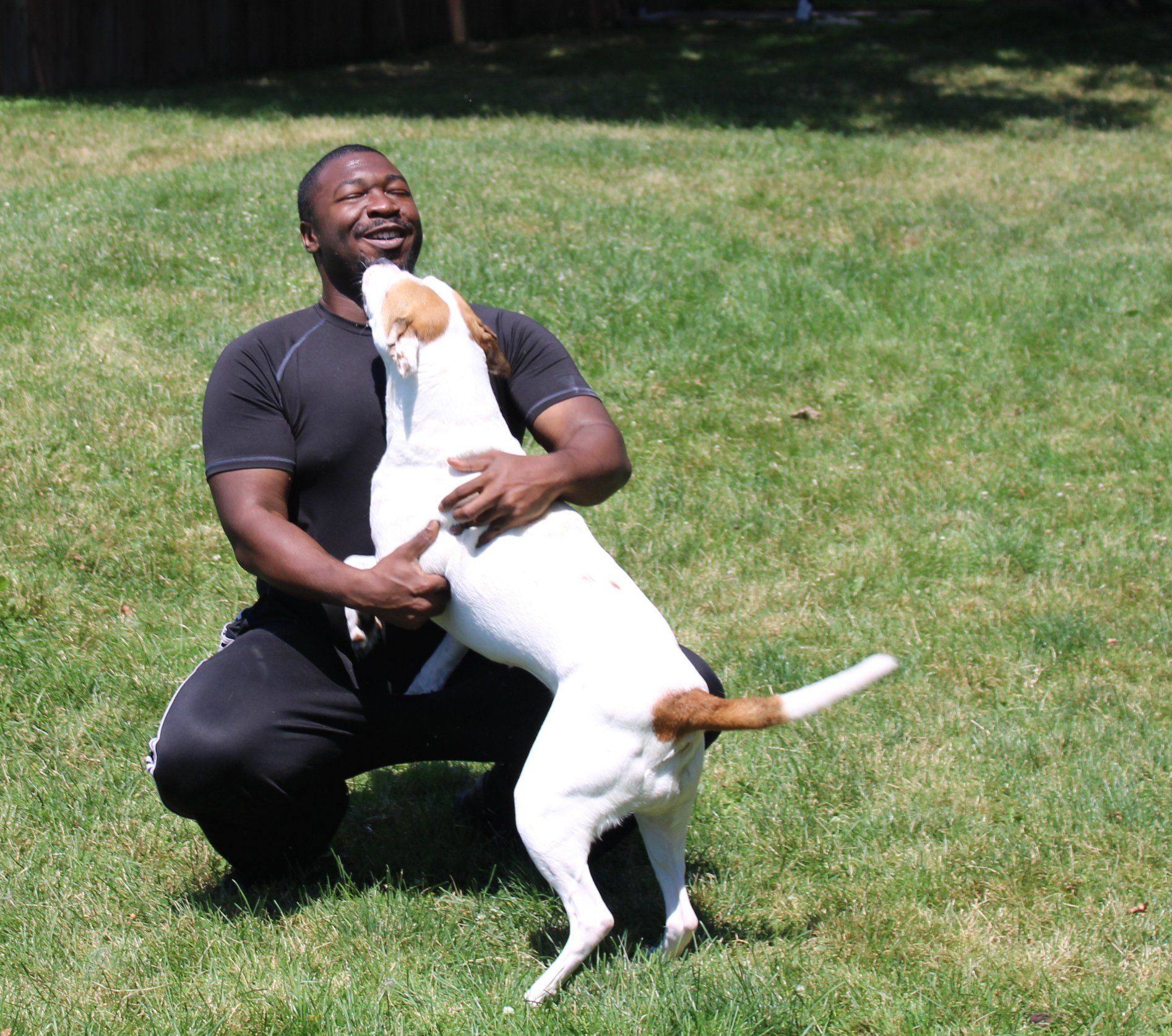 Dog Kissing A Man  — Clinton Twp., MI — Shores Kennels