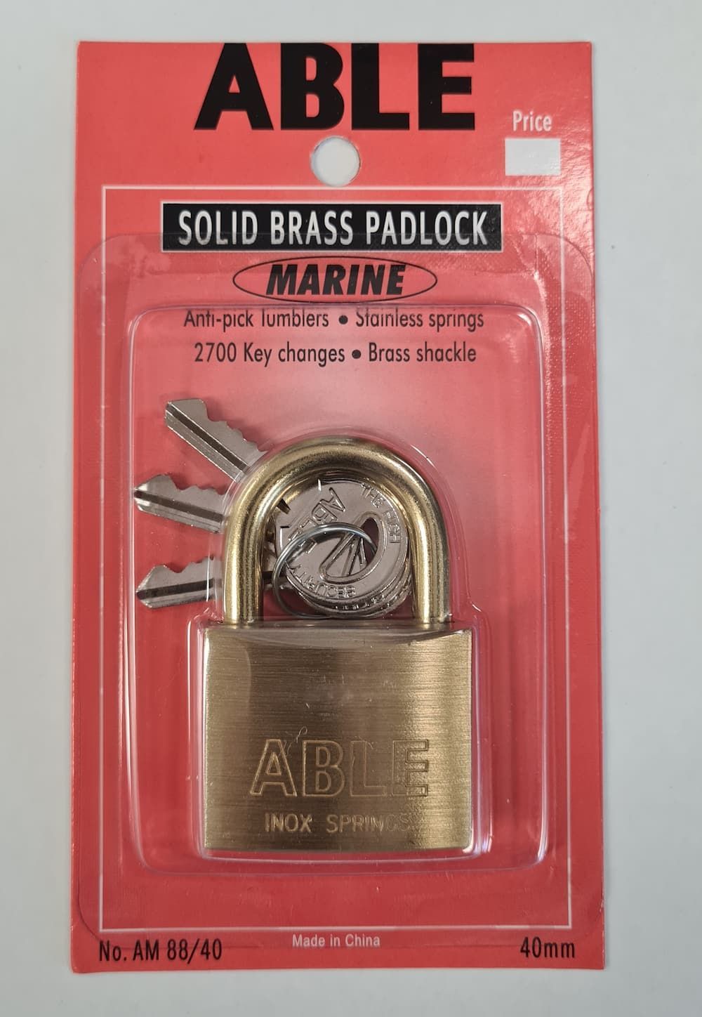 A Solid Brass Padlock In A Red Package With Keys  — Acacia Mini Storage in Port Macquarie, NSW
