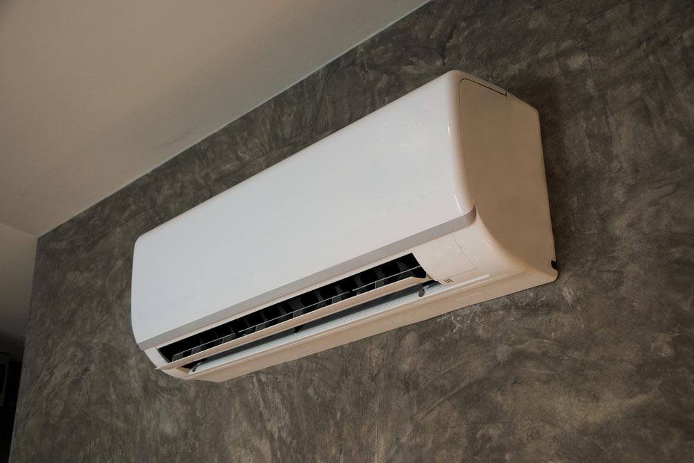 Air Conditioner System Saving Energy On Wall Background — Refrigeration & Air Conditioning in Kempsey, NSW