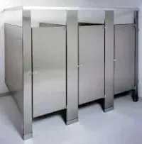 A Row Of Stainless Steel Toilet Cubicles In A Bathroom — Laredo, TX — South Central Hardware Inc.