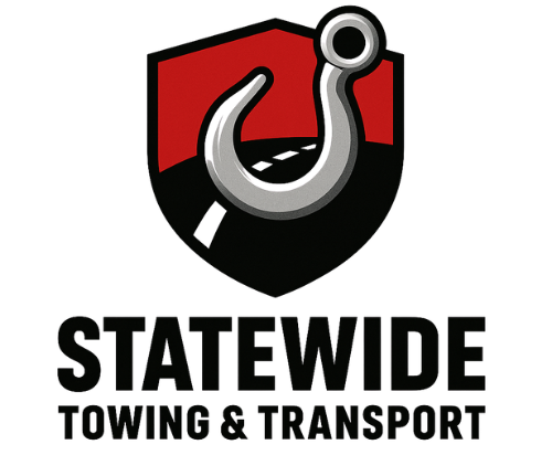 Statewide Towing & Transport logo: tow hook over a road within a shield-shaped design.