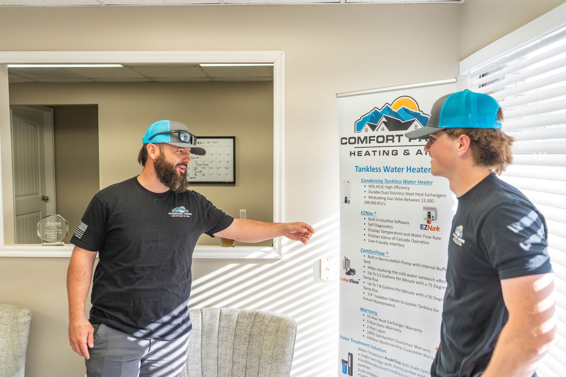 A white water heater is sitting in a room next to copper pipes.