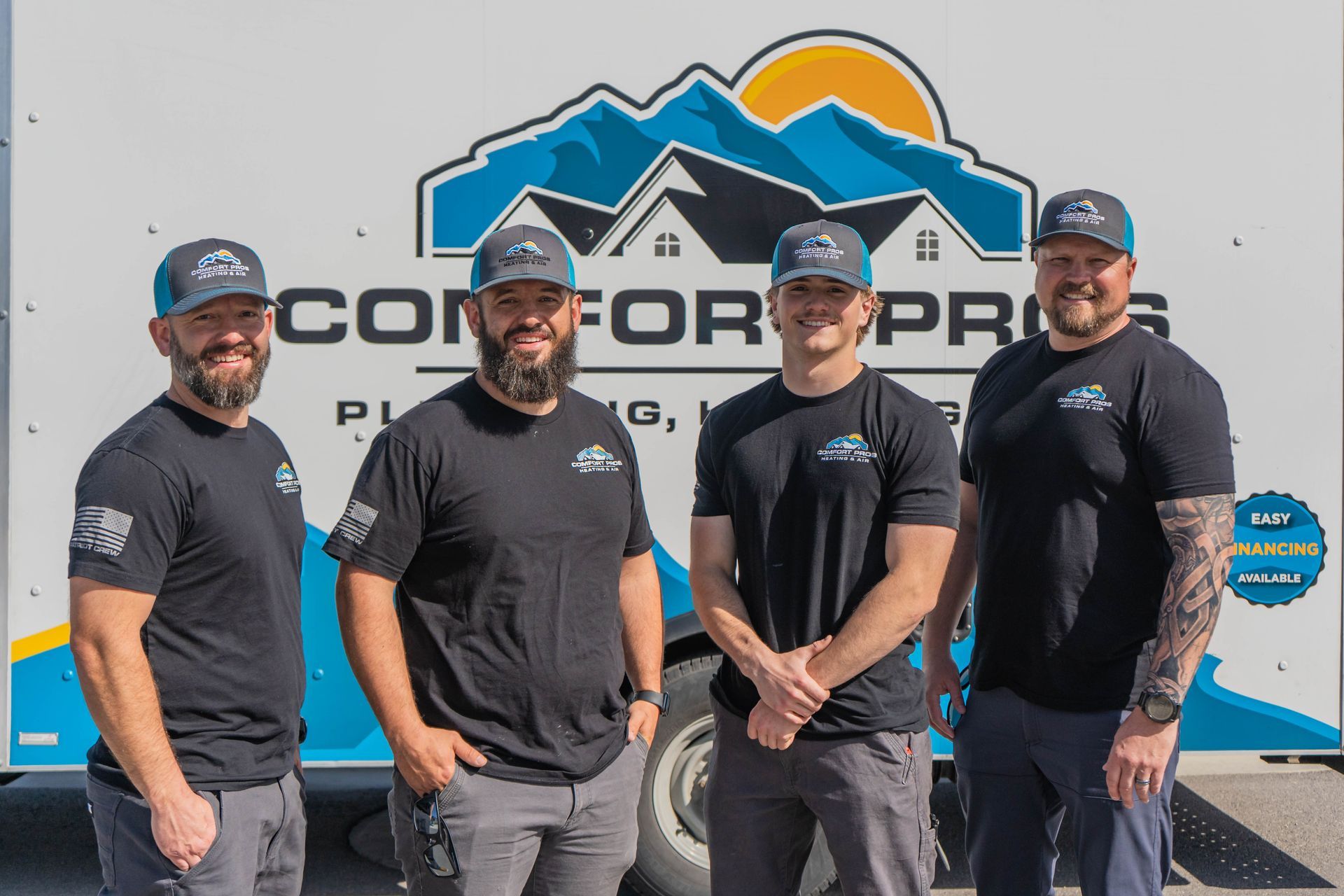 A woman is adjusting a light switch in a living room.