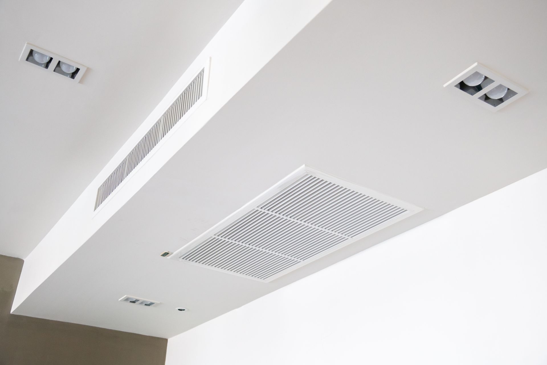 A close up of a ceiling with a fan on it.