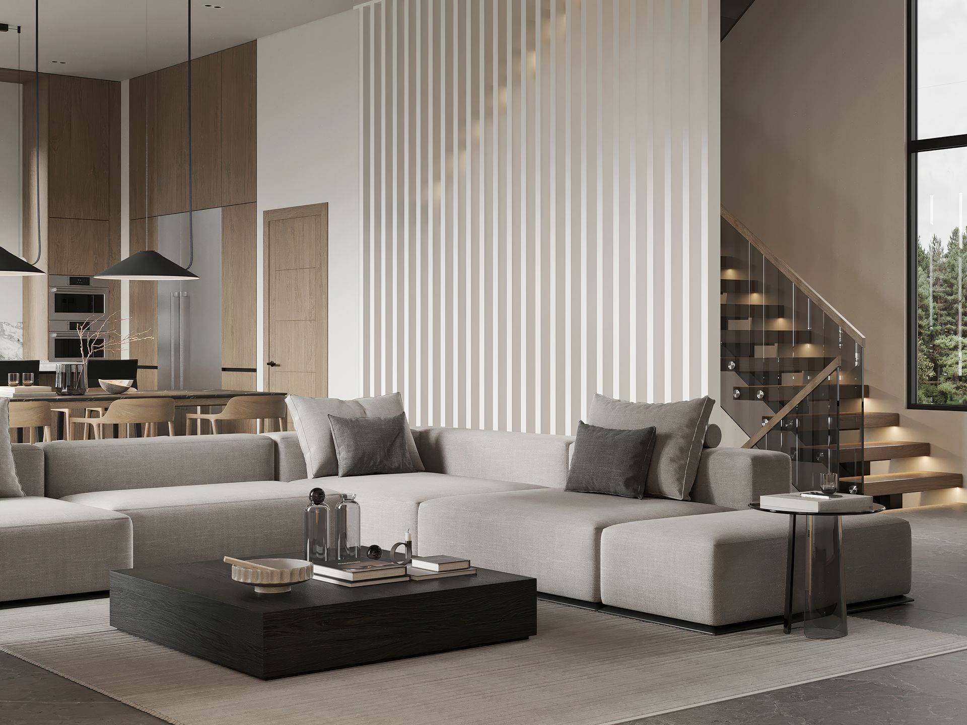 Modern living room with gray sectional sofa, coffee table, and staircase.