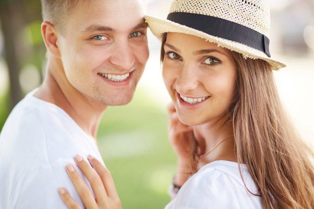 Happy Couple Smiling — Kansas City, MO — Koehn Dentistry & Aesthetics