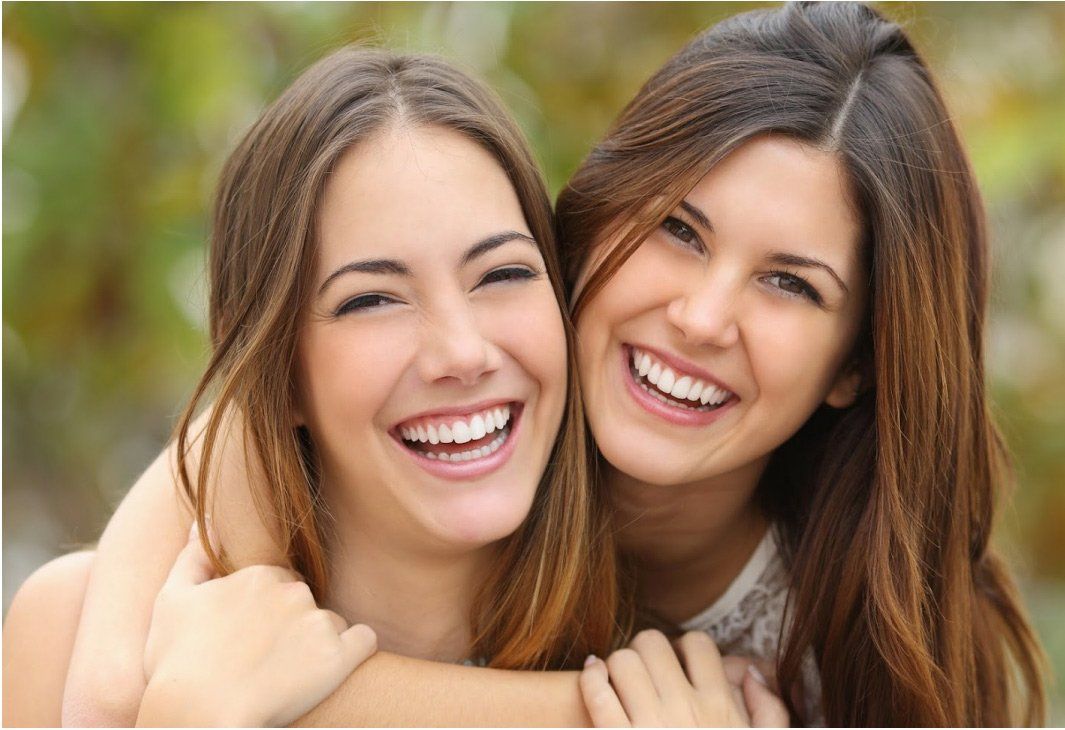 Two Smiling Woman — Kansas City, MO — Koehn Dentistry & Aesthetics