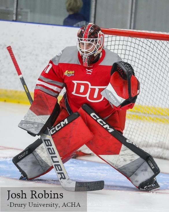 Drury University hockey goalie Josh Robins in a red and grey uniform, crouching in the crease with pads and stick ready.