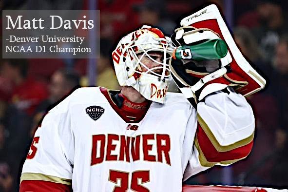Matt Davis, a Denver University ice hockey goalie in full uniform, drinks from a green bottle during a game.